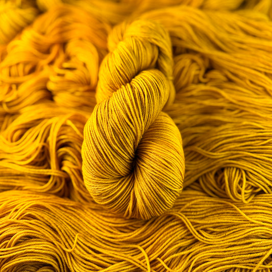 Dijon hand-dyed Deluxe Merino Sock yarn skein by Auridon Yarns